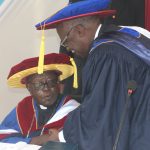 Outgoing Chancellor His Grace Zacchaeous Okoth counsults with the incoming Chancellor Professor Oyuko Mbeche